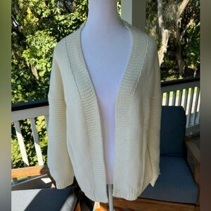 Cream colored cardigan with heart on the back